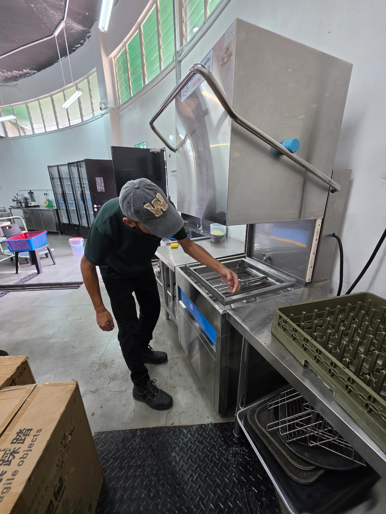 An EHS technician providing readily available spare parts to keep your dishwasher running efficiently.