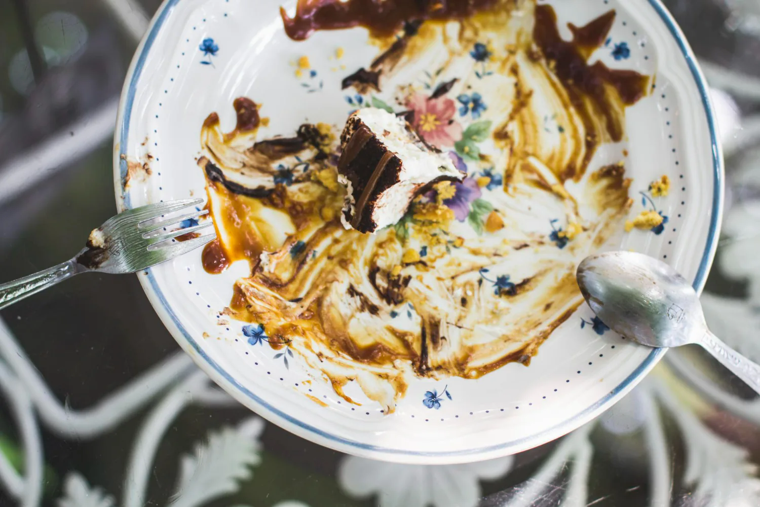 Excess food debris on the plates should be removed before using the dishwasher.